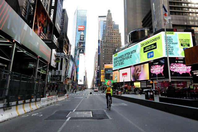 A bicyclist rides through Time Square in New York.